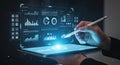 Person interacting with a futuristic digital dashboard on a tablet, displaying data analytics and business intelligence Royalty Free Stock Photo
