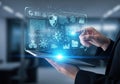 Person interacting with a futuristic digital interface displaying various icons and data Royalty Free Stock Photo