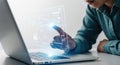 Person interacting with holographic interface projected from laptop technology futuristic digital data visualization Royalty Free Stock Photo