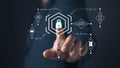 A person interacts with a futuristic interface featuring a glowing lock icon at the center, symbolizing cyber security and Royalty Free Stock Photo