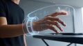 A Person Interacts with a Futuristic, Translucent Interface Projected from a Wristband Royalty Free Stock Photo