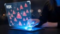 Business professional assessing digital risk and vulnerability on a futuristic transparent screen with warning signs. Royalty Free Stock Photo