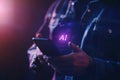 A person interacts with a holographic AI chatbot on a smartphone, utilizing artificial intelligence and deep learning Royalty Free Stock Photo