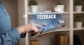 A person interacts with a tablet, focusing on the word \