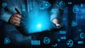 A person using a tablet device with digital futuristic interface elements, showcasing technology and data analysis in a Royalty Free Stock Photo