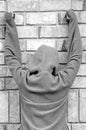 Person in jacket against wall Royalty Free Stock Photo
