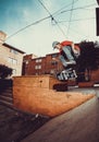 Person jumping with skateboard, film in street