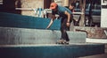 Person jumping with skateboard in school