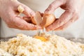 Person kneading dough on wooden table Royalty Free Stock Photo