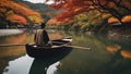 person on the lake Boatman punting the boat at river. in autumn season along the river