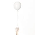 Person leaves their own white balloon free