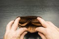 A person looks into an empty wallet. Royalty Free Stock Photo