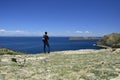 A person looks at observes the landscape on Isla Del Sol (Island of the Sun) on the Titicaca lake. Bolivia Royalty Free Stock Photo