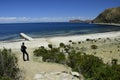 A person looks at observes the landscape on Isla Del Sol (Island of the Sun) on the Titicaca lake. Bolivia Royalty Free Stock Photo