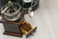 A person makes coffee in a coffee machine picks up ground coffee with a spoon from a coffee grinder drawer