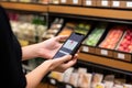 A person making a contactless payment at a retail store or using a mobile wallet app Royalty Free Stock Photo