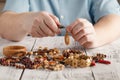 Person making earings from colorful beads and needles Royalty Free Stock Photo