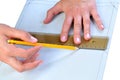 Person making a template on textile