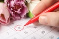 Person marking date 8th of March in calendar, closeup. International Women`s Day
