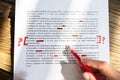 Person Marking Error With Red Marker Royalty Free Stock Photo