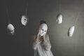 Person with mask does not want to hear the judgment of other masks, concept of judgment and introspection Royalty Free Stock Photo