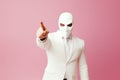 Person with a mask. Man wearing white suit and funny pigeon bird mask. Royalty Free Stock Photo