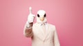 Person with a mask. Man wearing white suit and funny pigeon bird mask. Royalty Free Stock Photo