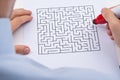 Person With Maze On Paper Royalty Free Stock Photo