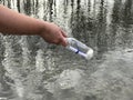 A person with a message in a crystal bottle Royalty Free Stock Photo