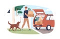 Person moving, carrying cardboard boxes and loading them into open hood of car. Man and dog leaving home. Relocation Royalty Free Stock Photo