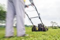 Person mowing a lawn Royalty Free Stock Photo