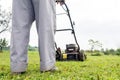 Person mowing a lawn Royalty Free Stock Photo