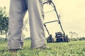 Person mowing a lawn Royalty Free Stock Photo