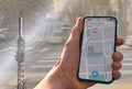 person with navigation app on city street