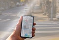 person with navigation app on city street