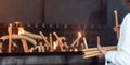 Person offering Candles at Sanctuary of Fatima - Fatima, Portugal Royalty Free Stock Photo