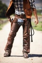 Person, outdoors and gun ready to shoot for standoff or gunfight in duel for wild western culture in Texas. Cowboy