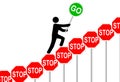 Person overcomes STOP signs raises GO sign Royalty Free Stock Photo