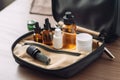 person, packing bag for trip to sunny destination, with bottle of cbd oil and products for relaxation