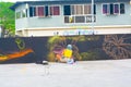 Person painting a mural on the side of a street-facing brick wall in Tegucigalpa