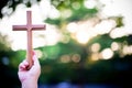 Person palm hands to hold holy cross, crucifix to worship. Royalty Free Stock Photo