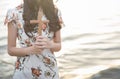 Person palm hands to hold holy cross, crucifix to worship. Royalty Free Stock Photo