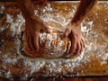 A person passionately kneading a fresh loaf of bread on a rustic wooden table Royalty Free Stock Photo