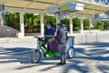 Person paying for rickshaw pedal taxi ride in the International Drive area 2