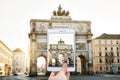 The person photographs for memory the Victory Triumphal Arch in Munich