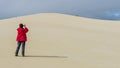 Person photographs the sand dunes of the Little Sahara desert on Kangaroo Island, Southern Australia