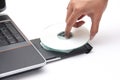 Person placing a compact disc in the cdrom drive Royalty Free Stock Photo