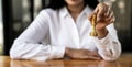 Person playing chess board game, business woman concept image holding chess pieces like business competition and risk management, Royalty Free Stock Photo