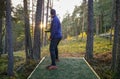 Person playing disc golf in a park