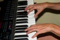 person playing with his hands the keys of a professional piano Royalty Free Stock Photo